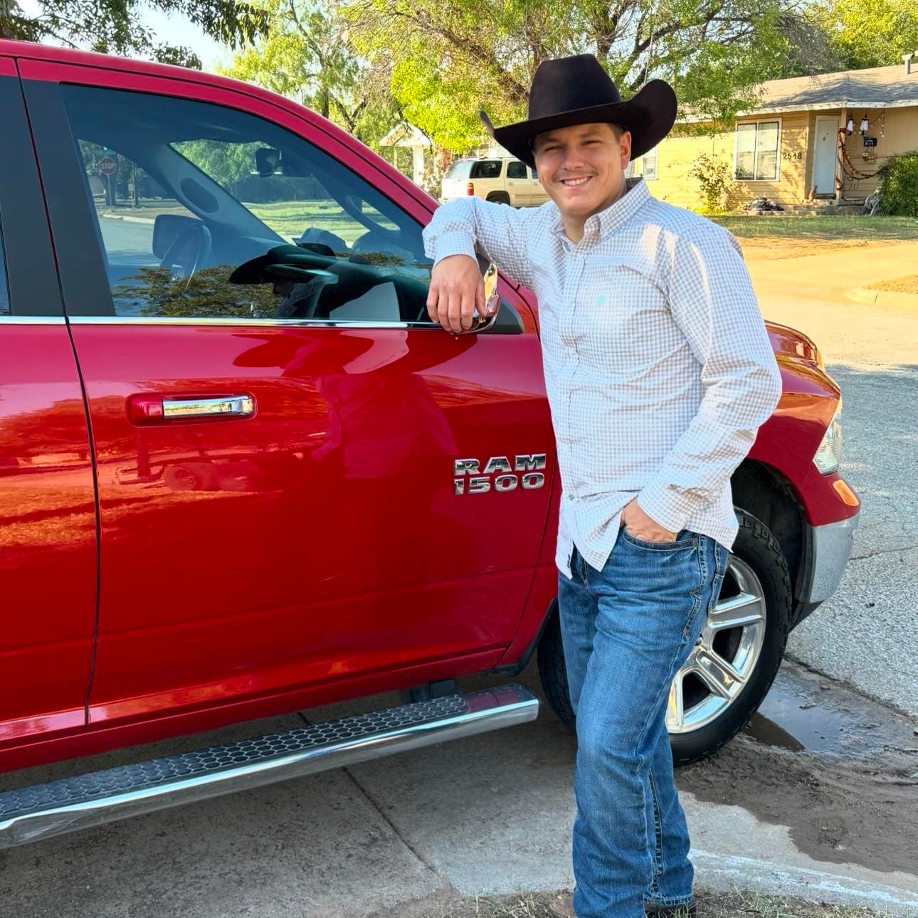 Outwest Mowing team member beside a work truck in Abilene, Texas