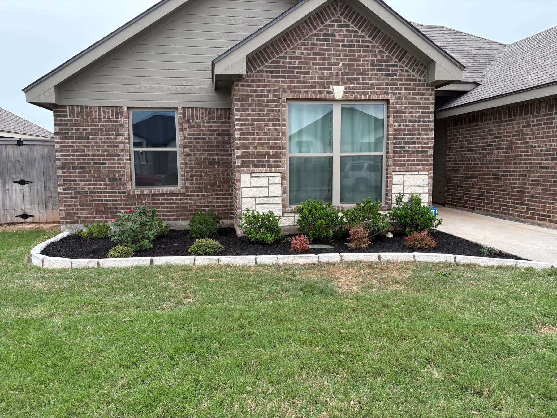 Completed Outwest flowerbed and landscaping project at an Abilene home